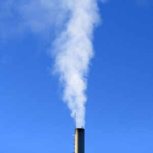a metal flue with lots of white smoke coming out