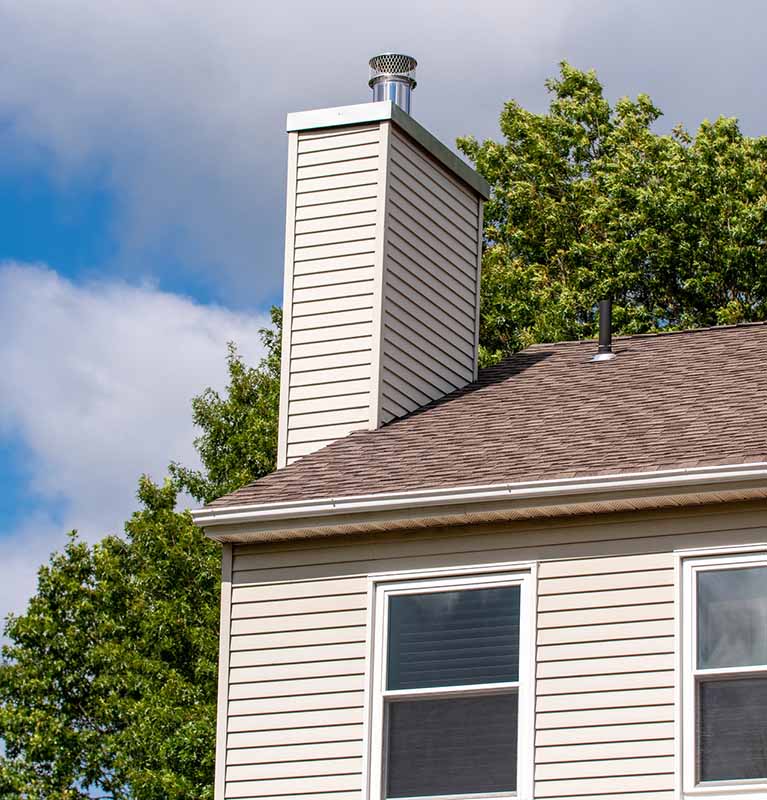 Top Hat & Tails Chimney - Stock image of chimney chase cover chimney with a new chase cover and cap